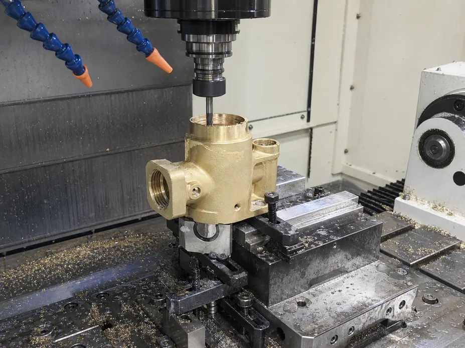CNC machining of brass bathroom faucet body showing valve seat bore precision at Wfaucet factory