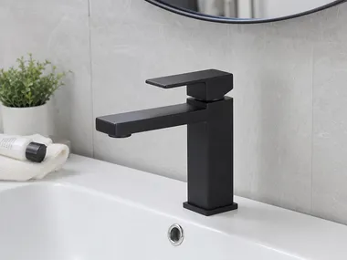 Modern bathroom faucet with geometric body profile and minimal detailing