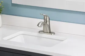 Single-handle centerset bathroom faucet for North American residential distribution
