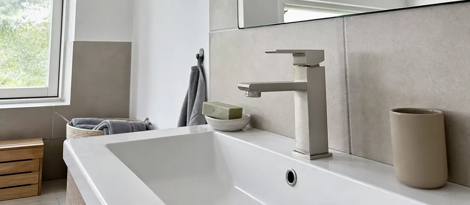European residential renovation bathroom with modern geometric faucet in brushed nickel