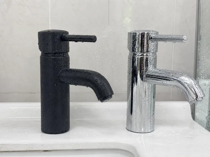 Side-by-side comparison of PVD matte black finish and chrome finish on modern bathroom faucet bodies showing durability in humid conditions
