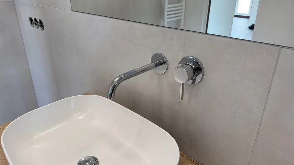 Wall mount faucet in European residential bathroom renovation