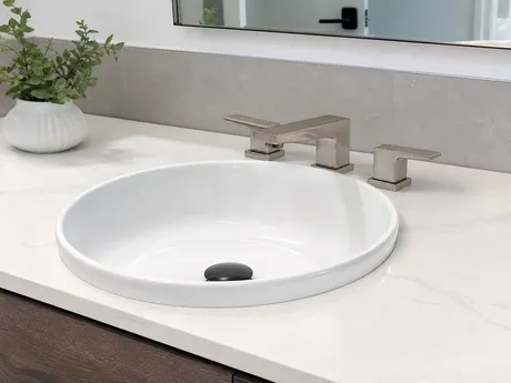 Low profile bathroom faucet for vessel sink installations