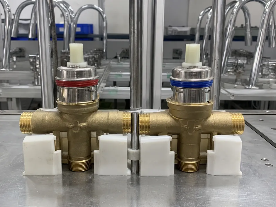 Ceramic disc cartridge valve assembly for widespread bathroom faucet showing hot and cold independent valve bodies
