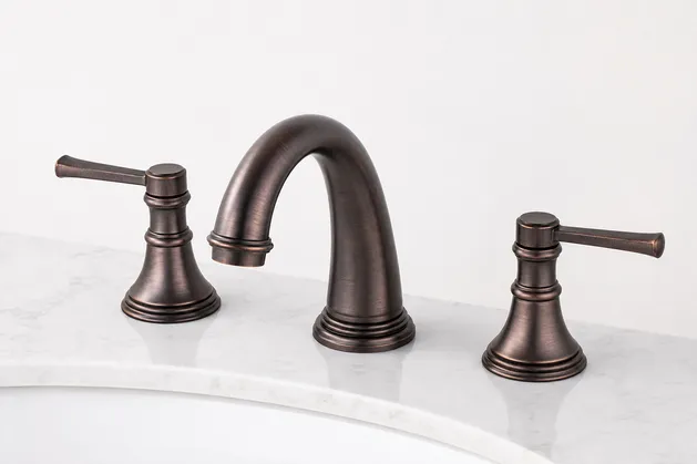 Oil-rubbed bronze finish widespread bathroom faucet — multi-layer plating with hand-applied antiquing
