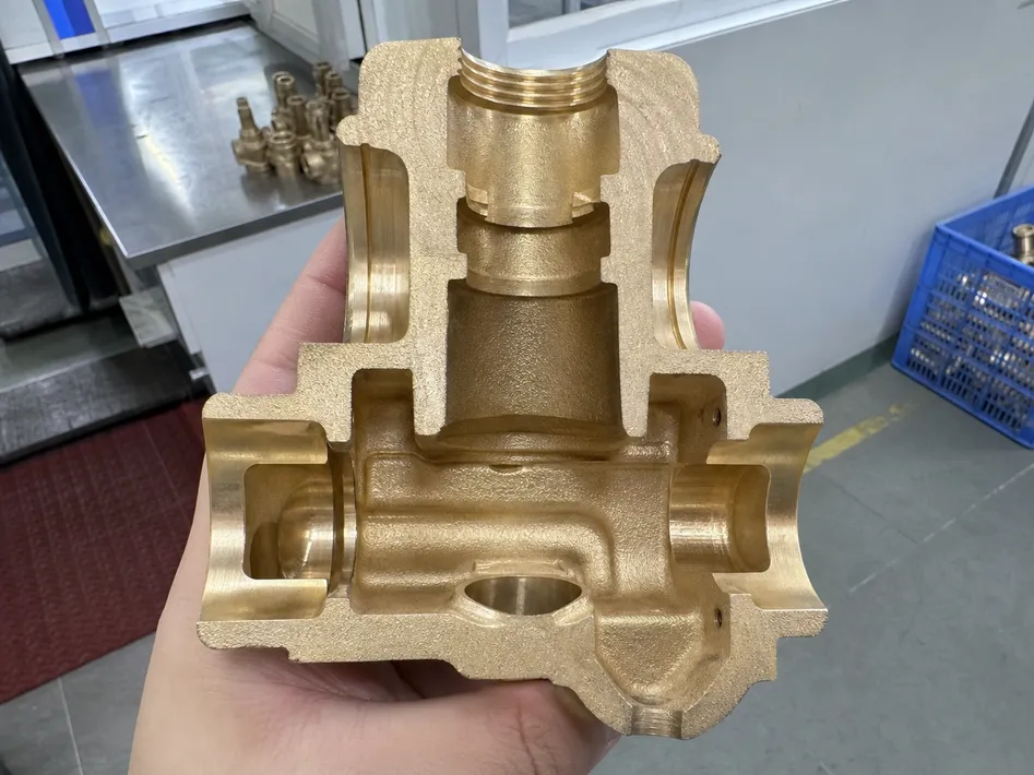 Gravity-cast brass valve body cross-section showing dense grain structure