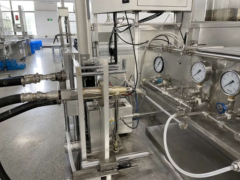Wax element thermostatic cartridge undergoing 500,000-cycle endurance testing on the production line
