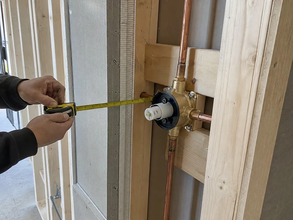 Concealed shower valve rough-in installation showing wall assembly depth and blocking requirements