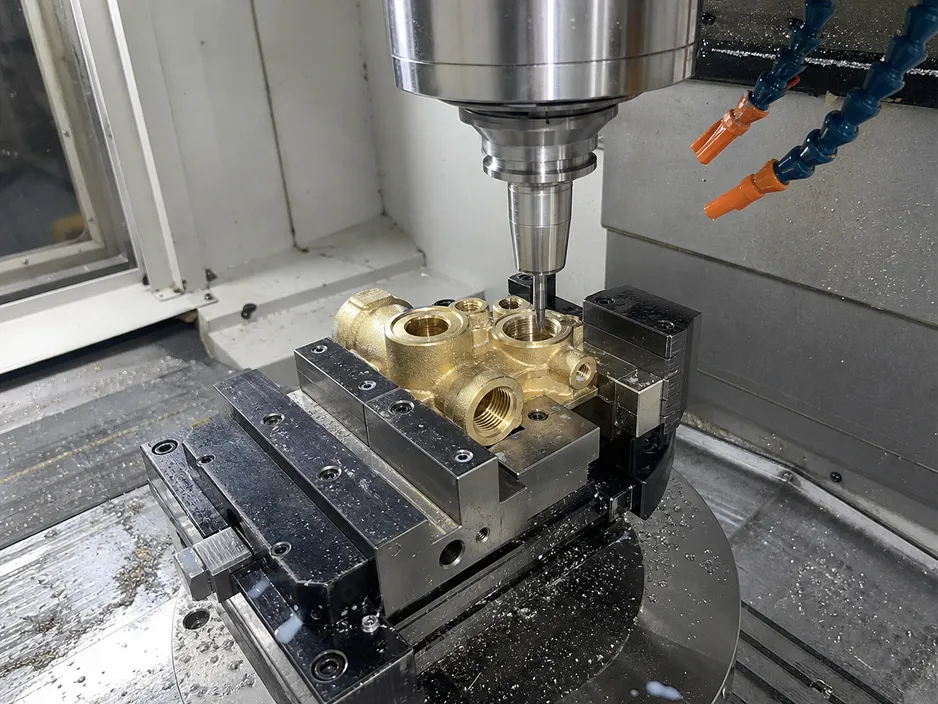 CNC machining of brass valve body showing precision seat interface tolerances
