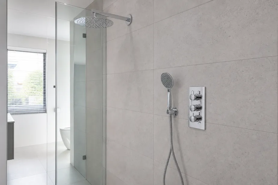 3 way concealed shower mixer — brass body with three-outlet diverter, chrome finish, installed in premium shower