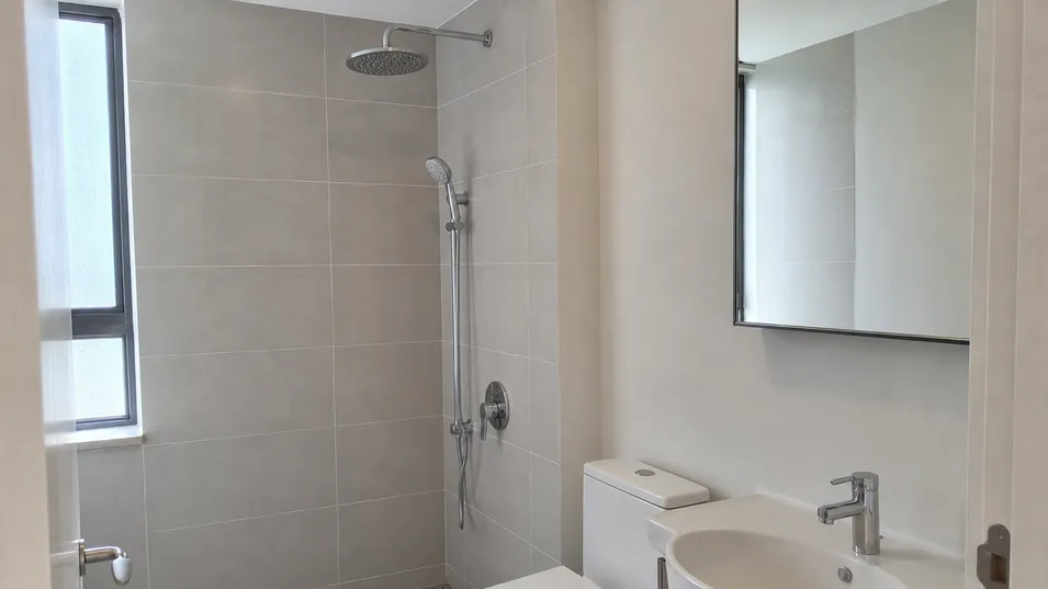 Concealed shower mixer installed in multi-unit residential development bathroom