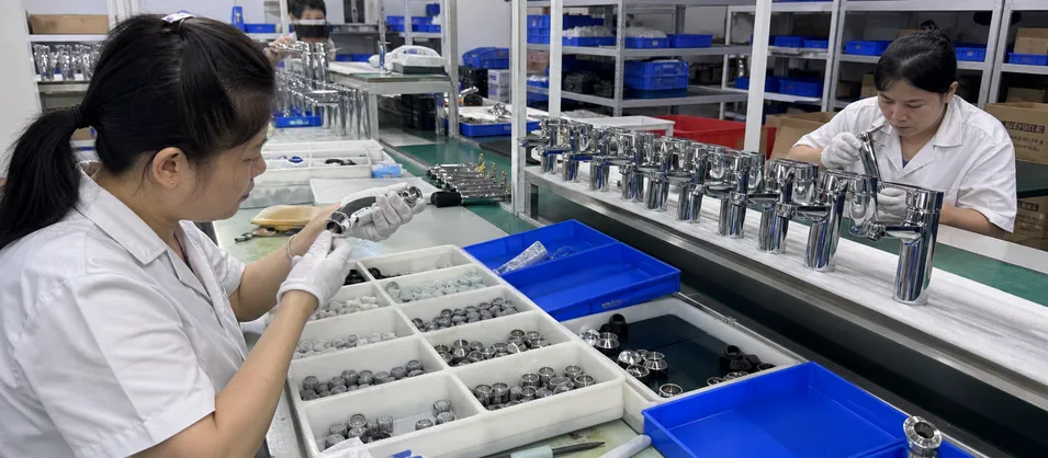 OEM faucet assembly line with aerators matched to faucet spout thread specifications