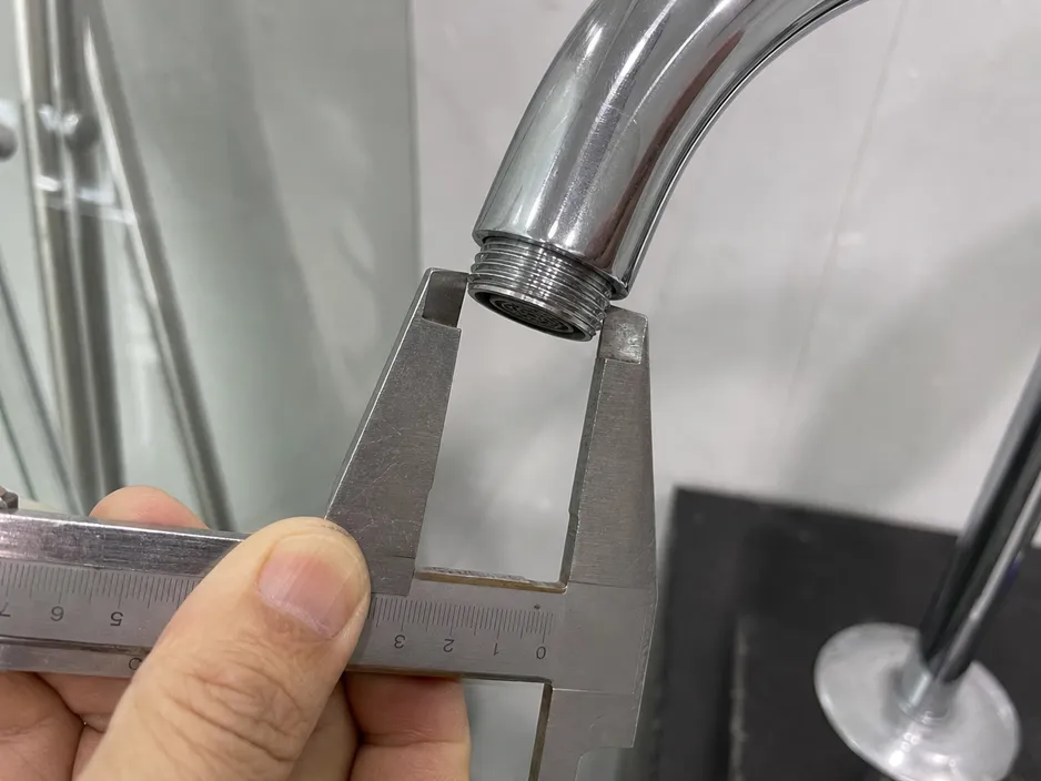 Measuring bathroom faucet spout thread diameter for aerator sizing