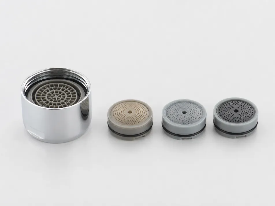 Kitchen faucet aerator flow restrictor disc variants — 1.5, 1.8, and 2.2 GPM insert discs for a single housing SKU