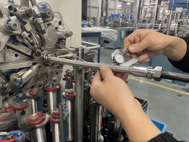 Stainless steel braiding machine tension calibration for hose manufacturing