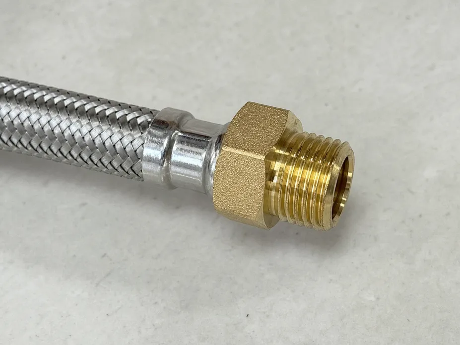 Close-up of 304 stainless steel braiding and C36000 brass end fitting on kitchen faucet supply hose