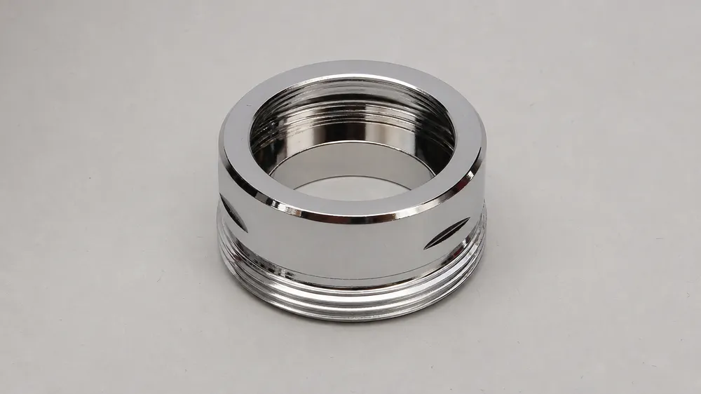 Brass C36000 sink aerator housing showing thread detail and chrome finish