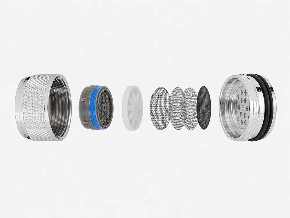 Exploded view of water faucet aerator showing separate flow restrictor disc, multi-layer mesh stack, and brass housing components