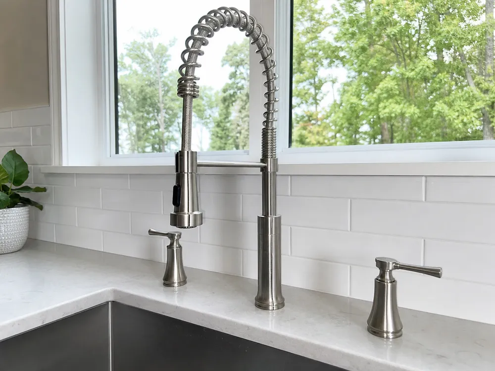 Two-handle widespread brushed nickel kitchen faucet — separate spout and handle deck mount