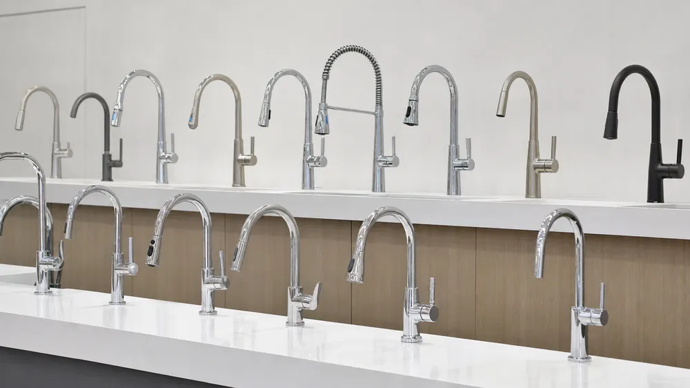 Chrome kitchen faucet wholesale distribution catalog display showing product range