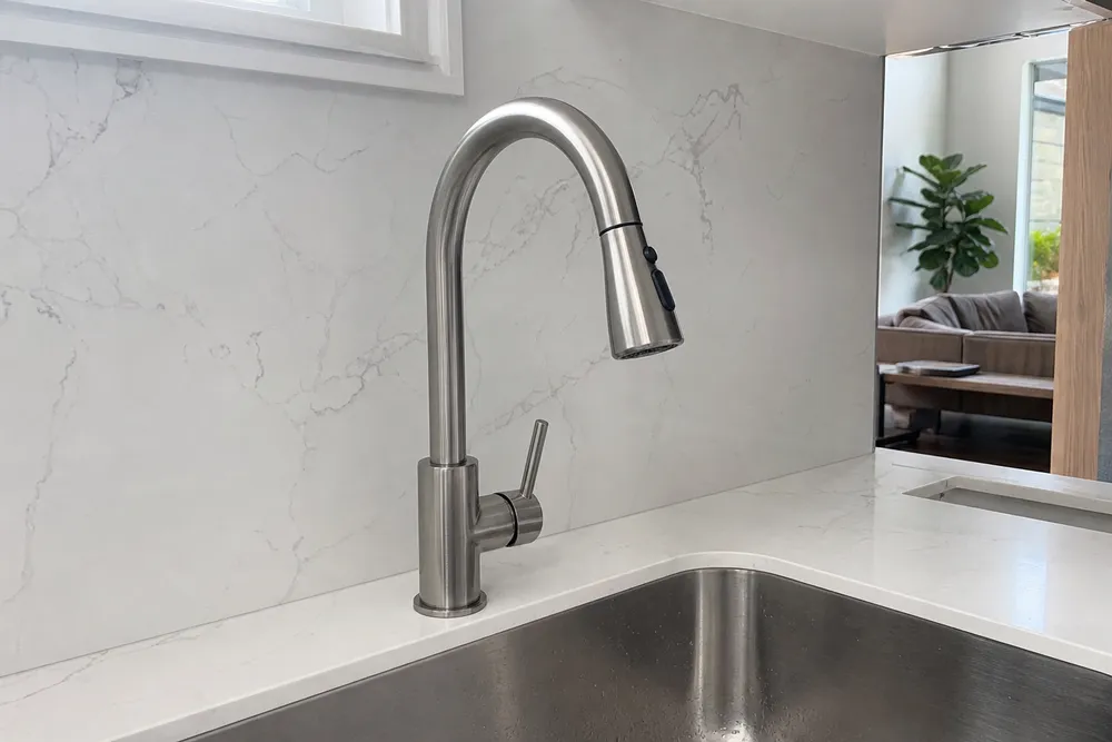 Deck mount kitchen faucet installed on countertop — 1-hole single-handle configuration