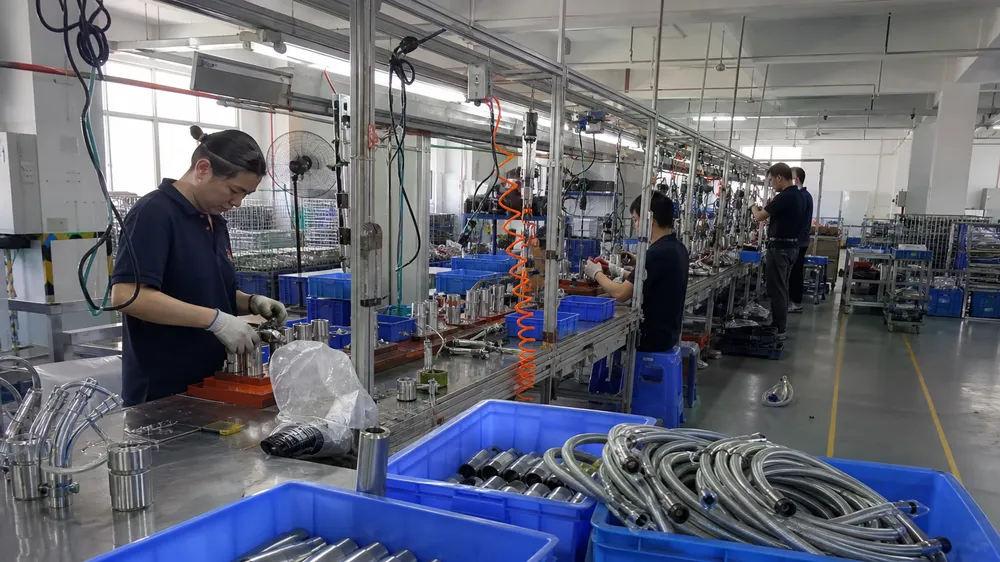 Wfaucet manufacturing facility — kitchen faucet sprayer production line