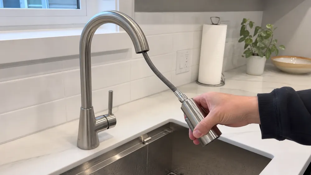 Pull-down integrated kitchen faucet sprayer — spray head retracts into spout body