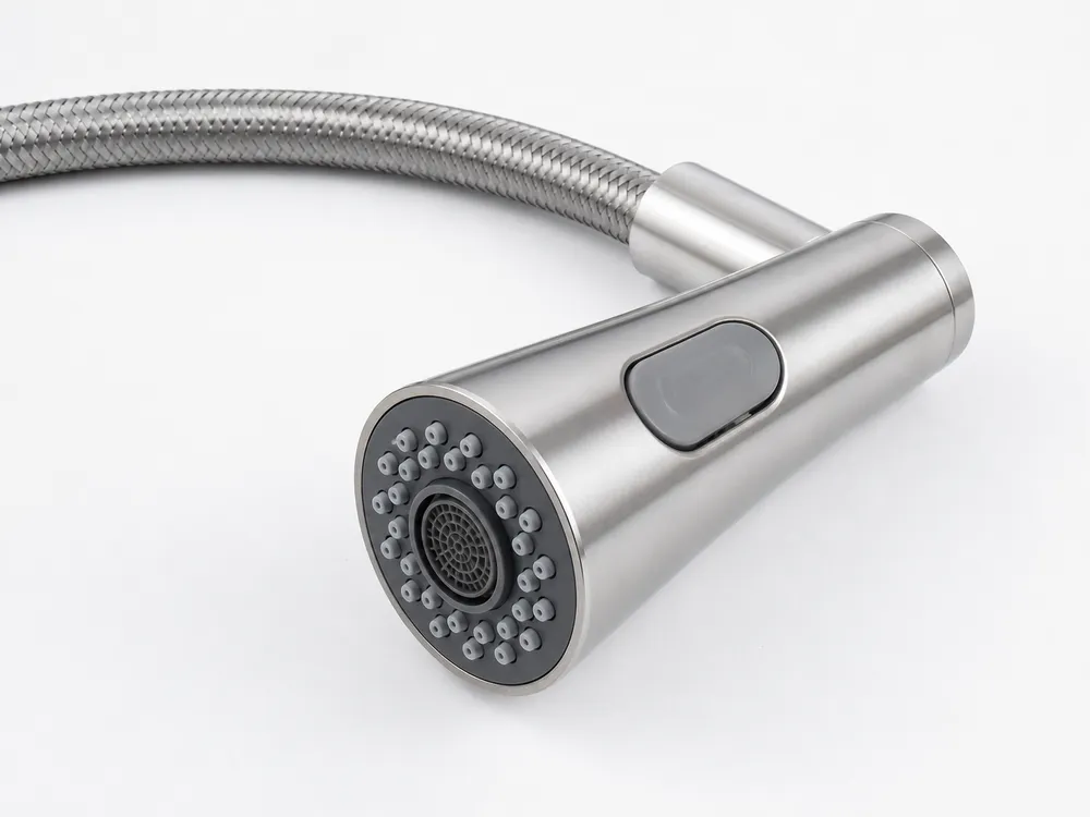 Kitchen faucet sprayer head construction — silicone nozzle face, braided stainless hose, and sealed mode-select button