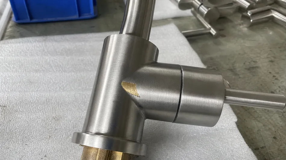 Brass body faucet with PVD brushed nickel finish showing coating layer