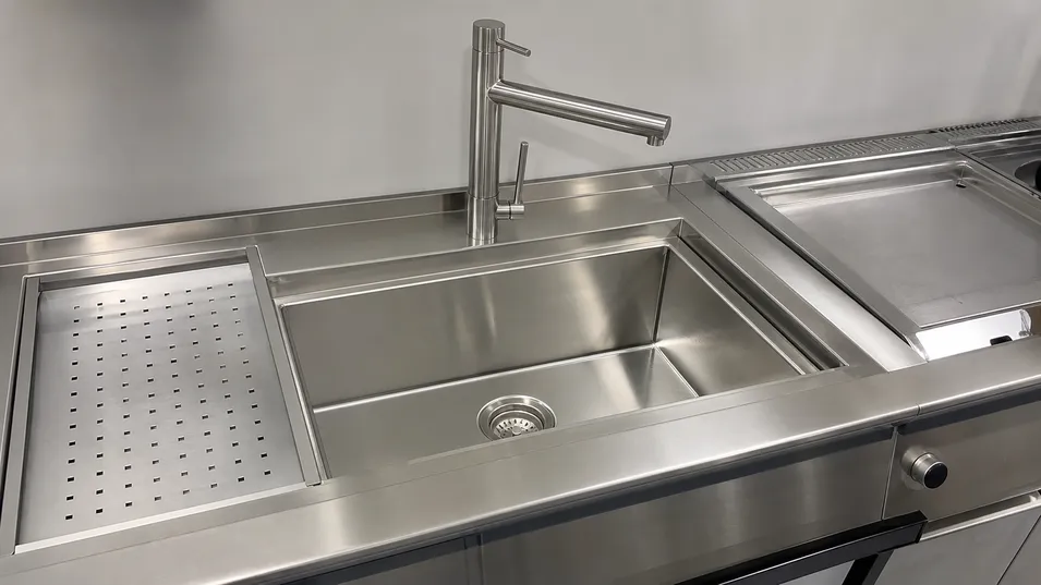 OEM stainless steel faucet integrated into kitchen sink and appliance bundle system