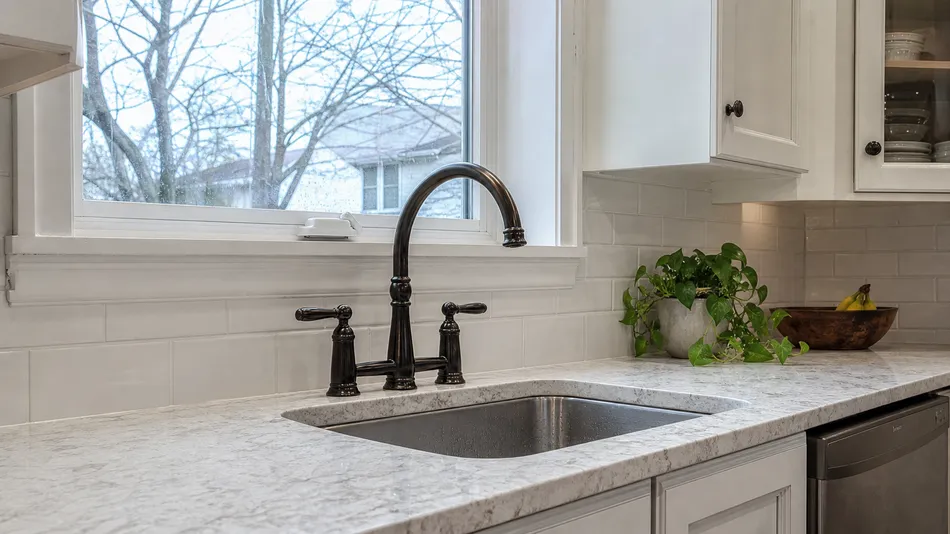 North American traditional kitchen renovation with two-handle faucet in oil-rubbed bronze finish