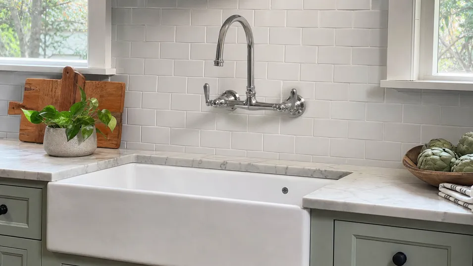 Wall mount kitchen faucet paired with farmhouse apron-front sink in residential kitchen renovation