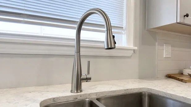 Brushed nickel kitchen faucet over a sink