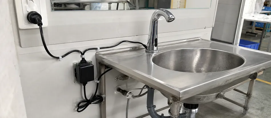 AC-powered sensor faucet with transformer and mains connection