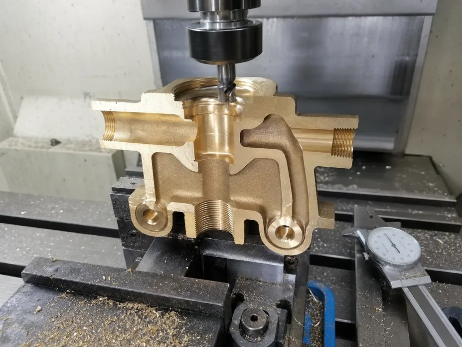 Gravity cast brass valve body cross-section showing diverter channel machining — Wfaucet