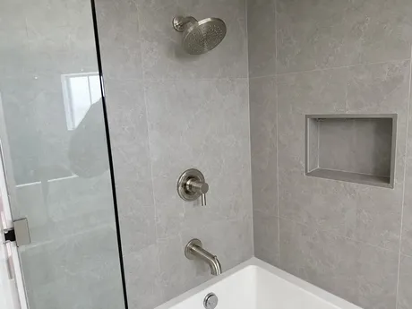 Wall mounted shower valve and trim assembly
