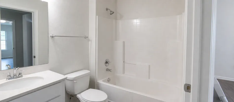 Multi-unit apartment complex bathroom specification with consistent shower valve across all units