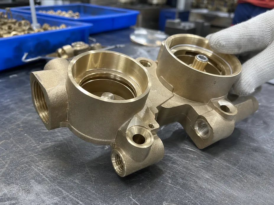 Close-up of gravity-cast brass valve body for wall mount shower faucet showing surface finish quality before plating