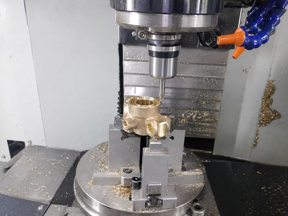 CNC machining of brass beverage faucet body showing valve seat precision