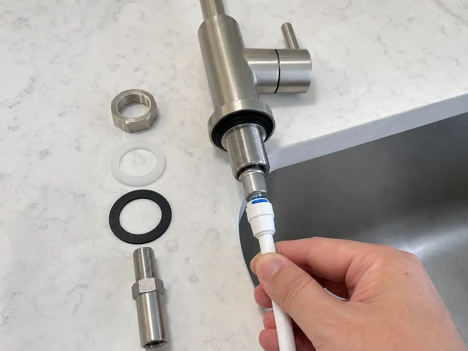Brushed nickel water filter faucet installation steps showing mounting hardware and push-fit supply line connection