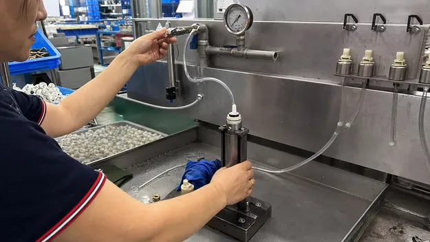 Ceramic disc cartridge being tested at low pressure for RO faucet drip prevention