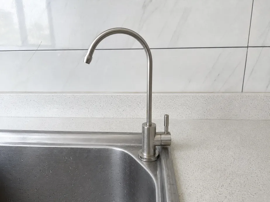 Under sink water filter faucet — brass body, brushed nickel finish, installed on countertop